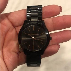 Black and gold Michael Kors watch